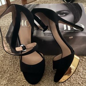 NWT - Open toe black and gold platform with a stiletto heel - Never Worn